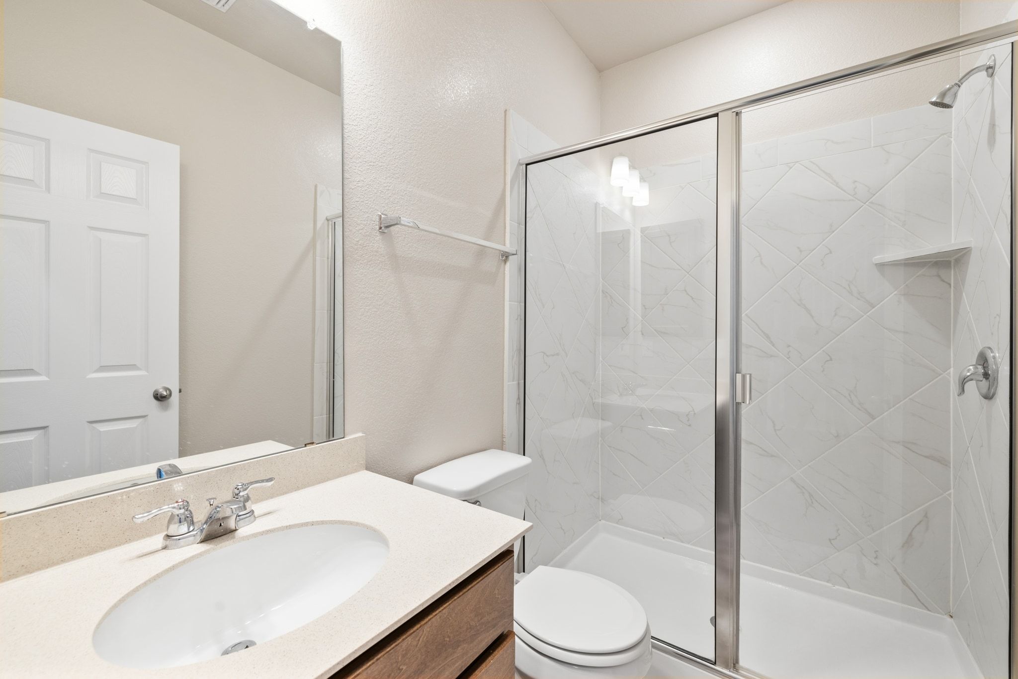 1829 Stringer Pass Leander, TX 78641 - Photo 7 of 36 Bathroom with vanity and a marble finish shower