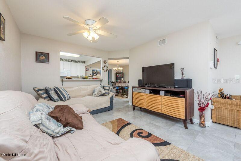 501 Southwest 75th Street Gainesville, FL 32607 - Photo 1 of 1 a bedroom with furniture and a flat screen tv