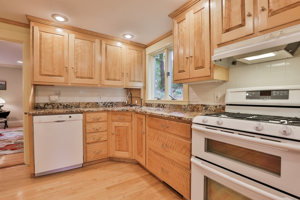 74 River Road Merrimac, MA 01860 - Photo 14 of 29 a kitchen with granite countertop cabinets stainless steel appliances and a sink