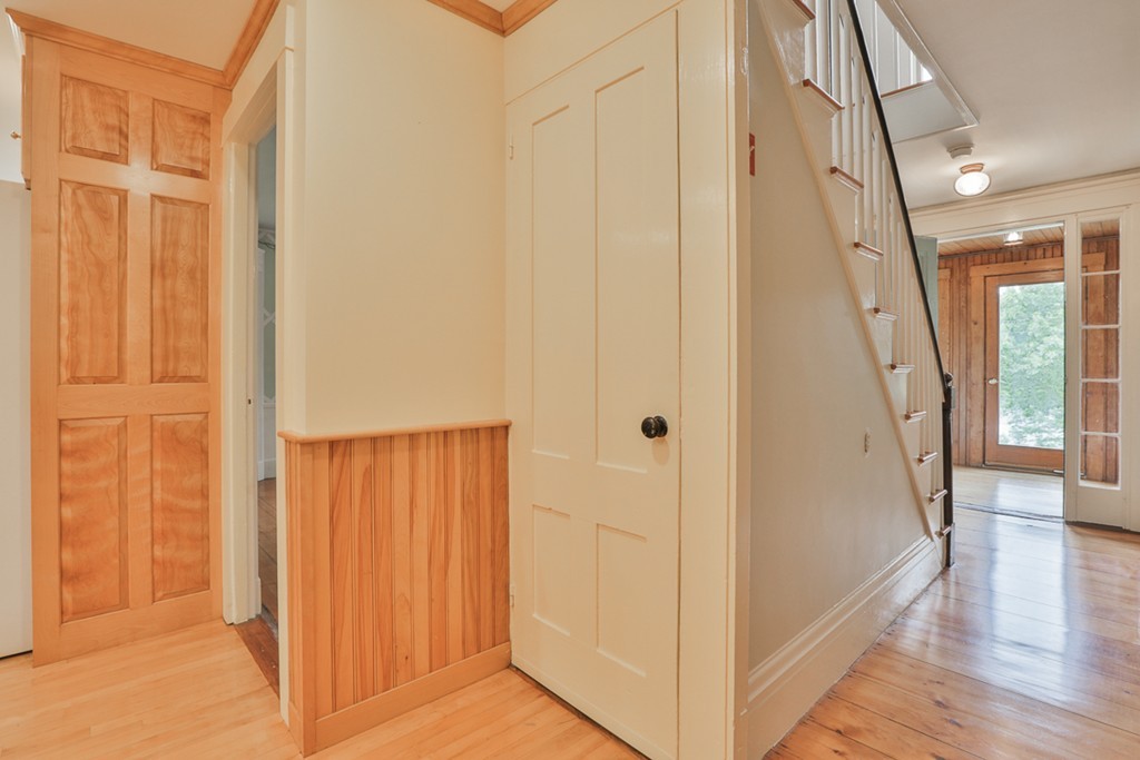 74 River Road Merrimac, MA 01860 - Photo 18 of 29 a view of a hallway with wooden floor and staircase
