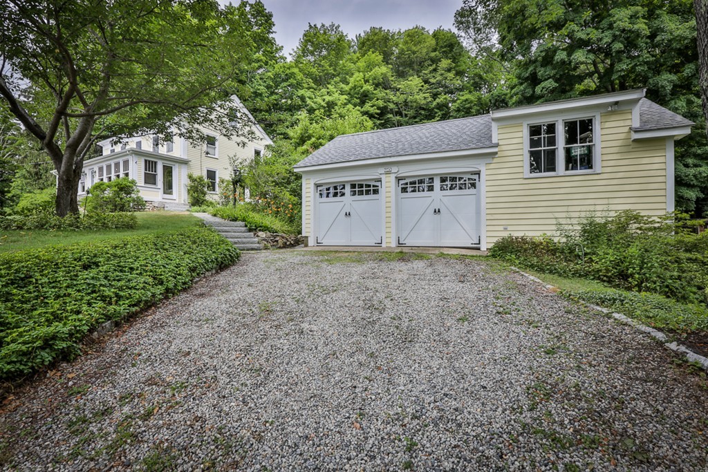 74 River Road Merrimac, MA 01860 - Photo 2 of 29 a house with trees in the background