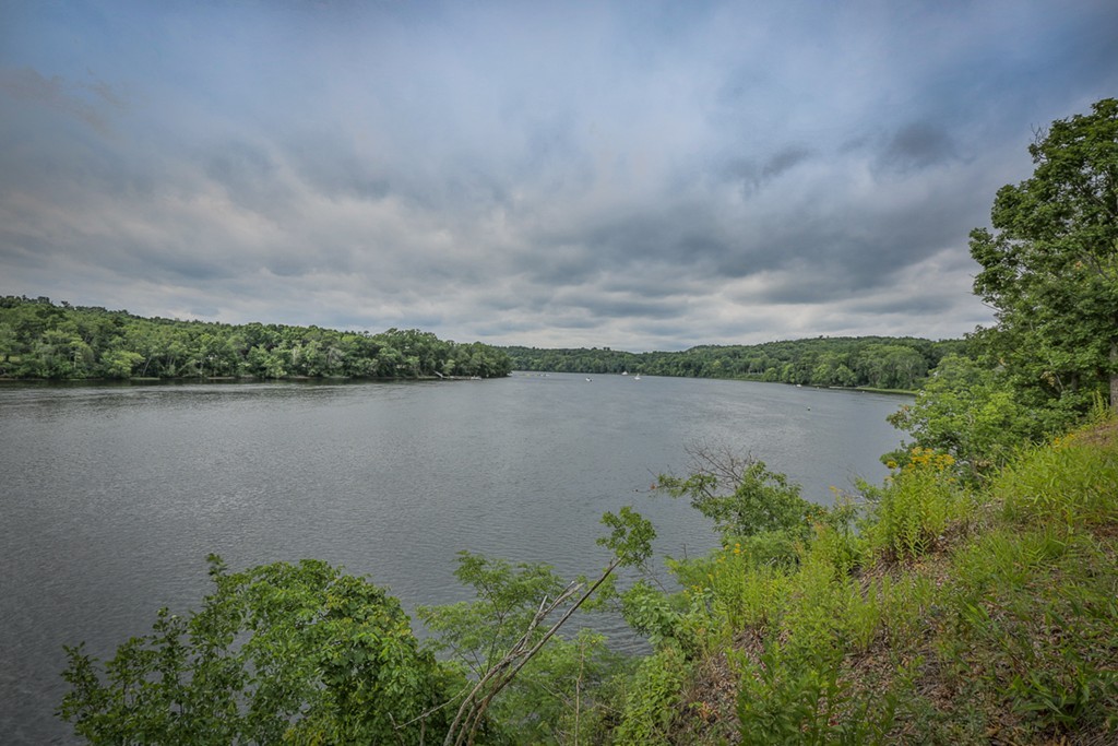 74 River Road Merrimac, MA 01860 - Photo 4 of 29 a view of a lake with houses in the back