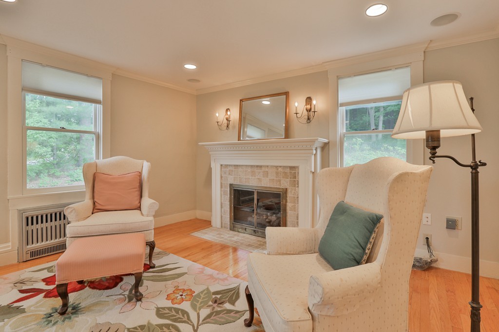 74 River Road Merrimac, MA 01860 - Photo 8 of 29 a living room with furniture and a fireplace