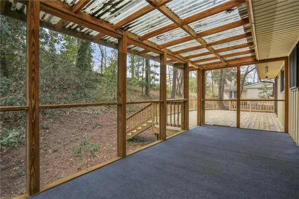a view of an empty room with a large window