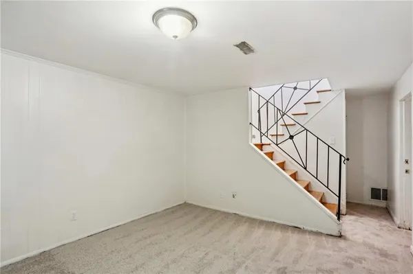 a view of a room with white walls