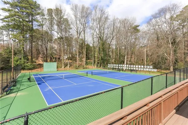 a view of an outdoor space and basketball court
