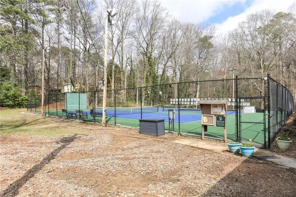 a view of outdoor space with deck and trees