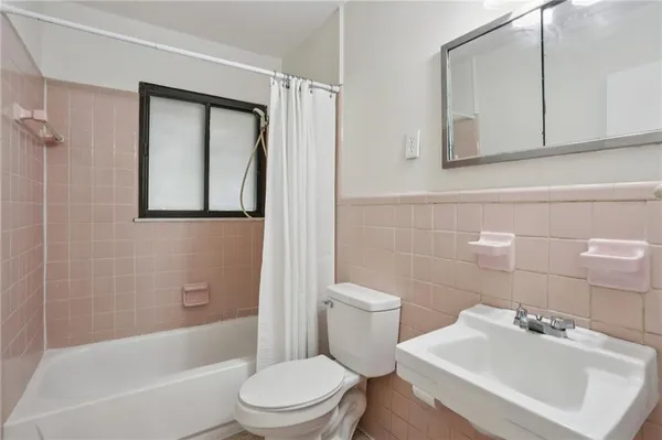a bathroom with a toilet sink and bathtub