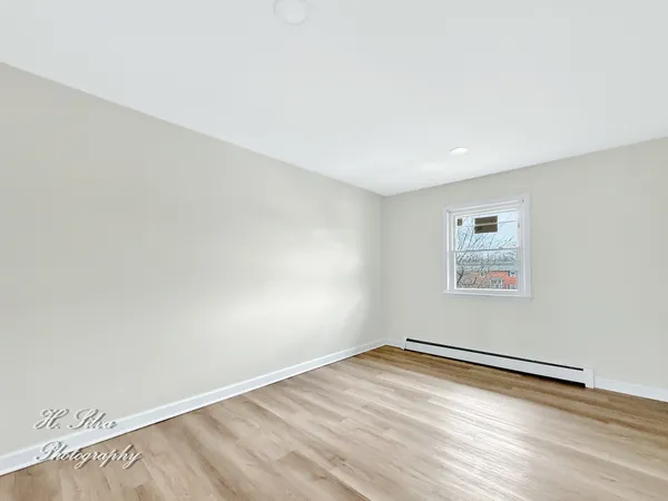 a bathroom with a sink toilet vanity and tub