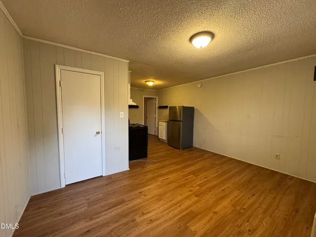 a view of an empty room with a gallery