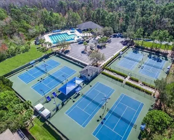 a view of a golf course with a ocean