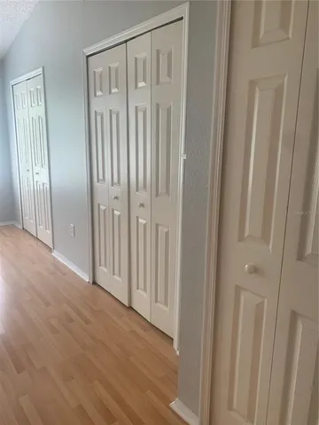 a view of an empty room with a window