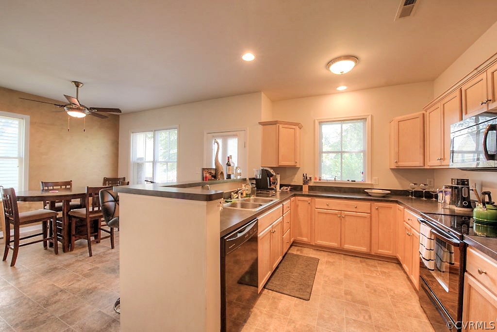 1308 Decatur Street Richmond, VA 23224 - Photo 18 of 30 a kitchen with lots of counter top space and dining table