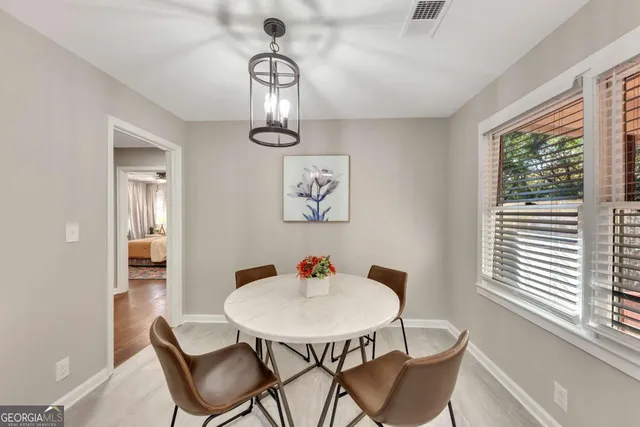 a view of a dining room with furniture window and outside view