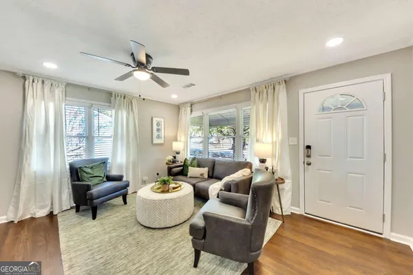 a living room with furniture and a large window