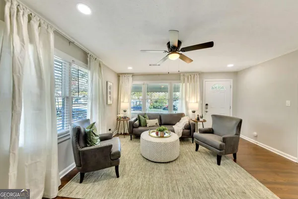a living room with furniture and a large window