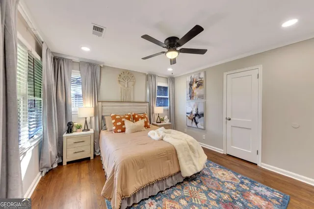 a bedroom with a large bed and a window