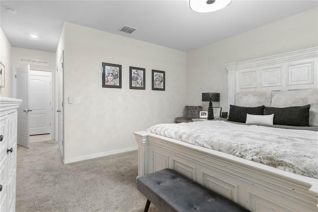 225 Sunset Point Drive Ormond Beach, FL 32174 - Photo 19 of 53 a bedroom with a bed and a couch