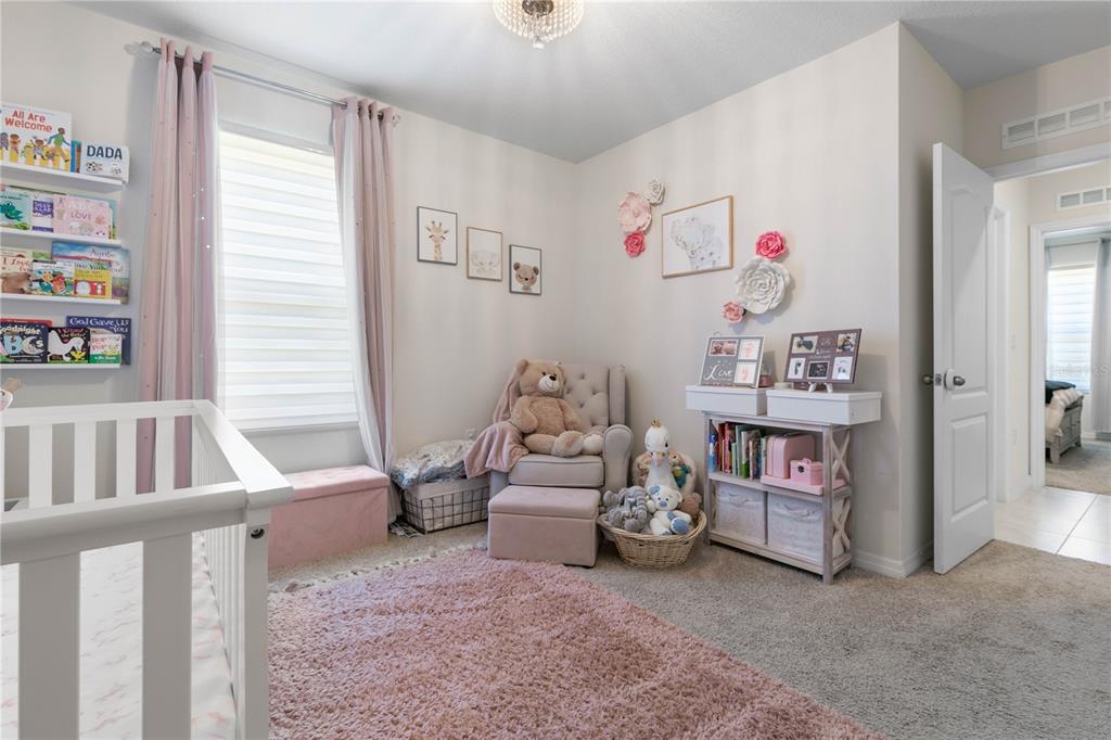 225 Sunset Point Drive Ormond Beach, FL 32174 - Photo 28 of 53 a bedroom with furniture and a window