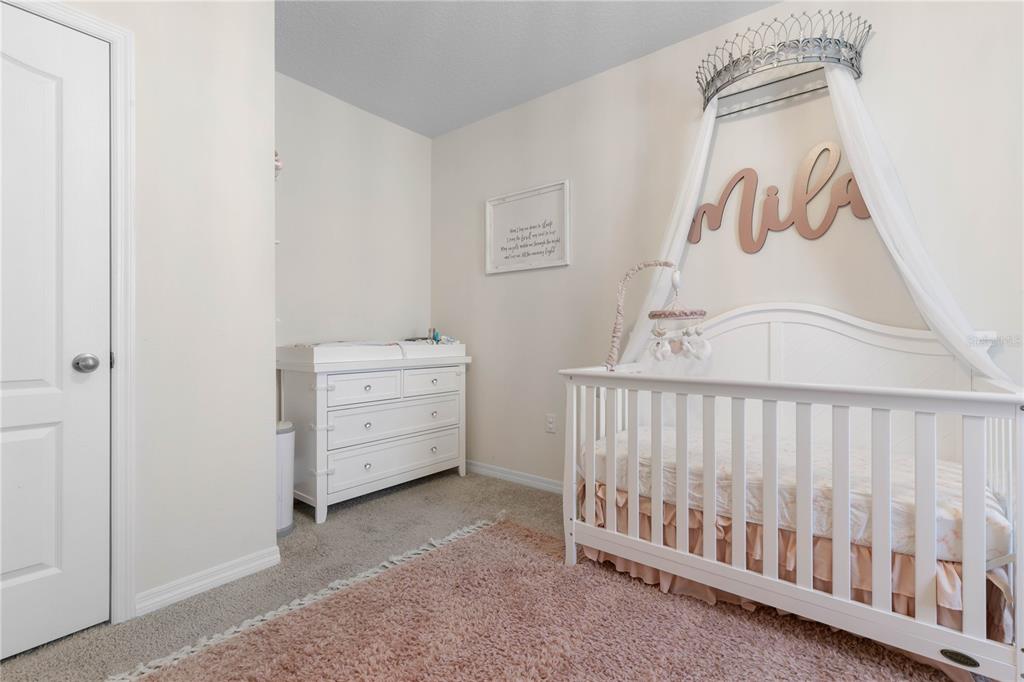 225 Sunset Point Drive Ormond Beach, FL 32174 - Photo 29 of 53 a view of a bedroom with baby crib