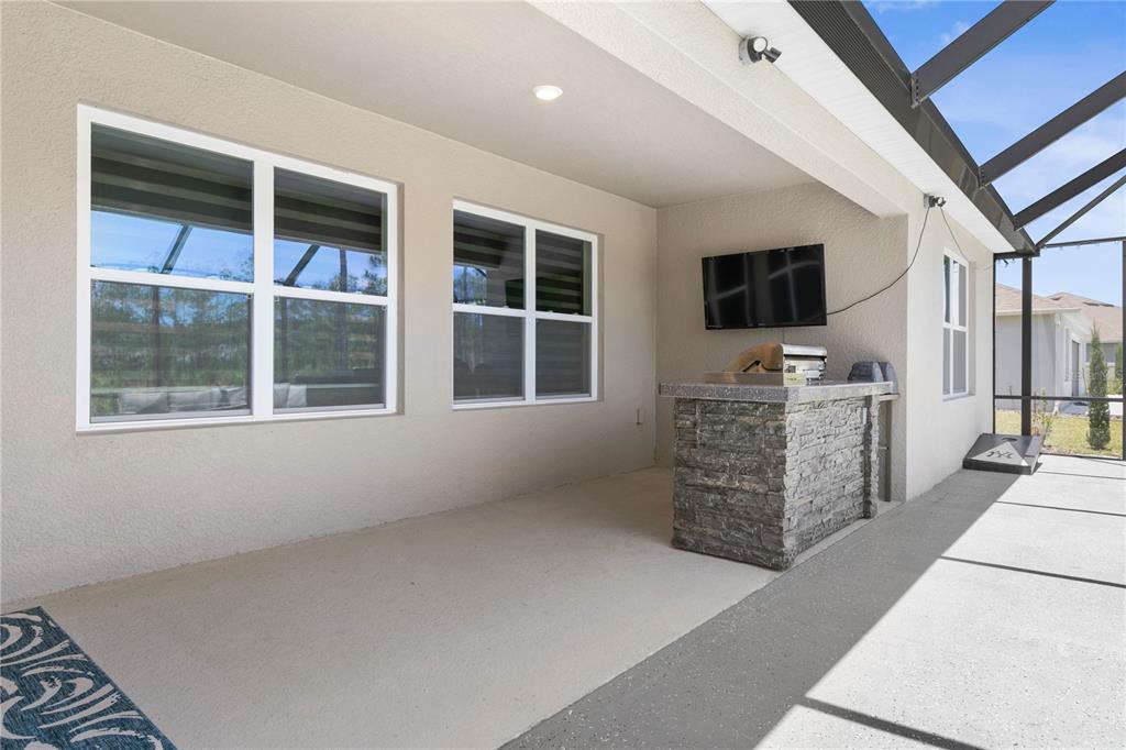 225 Sunset Point Drive Ormond Beach, FL 32174 - Photo 36 of 53 a room with furniture and flat screen tv