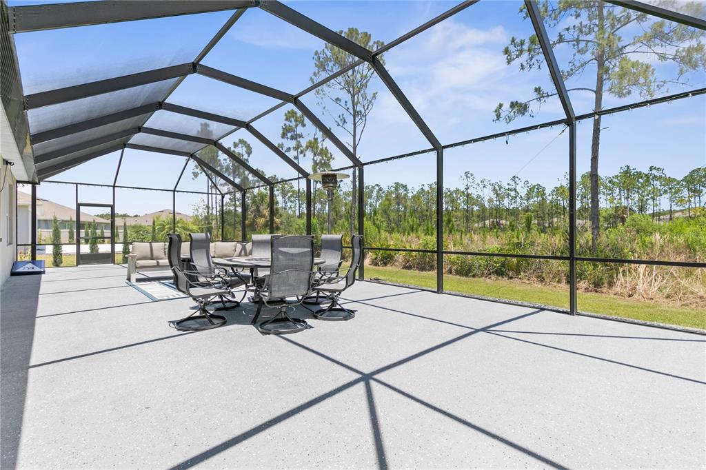 225 Sunset Point Drive Ormond Beach, FL 32174 - Photo 43 of 53 a view of a living room with furniture and floor to ceiling window