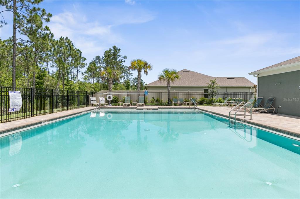 225 Sunset Point Drive Ormond Beach, FL 32174 - Photo 50 of 53 a view of a house with a swimming pool