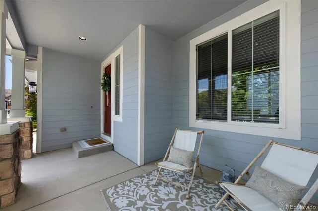 a living room with a couch and a window