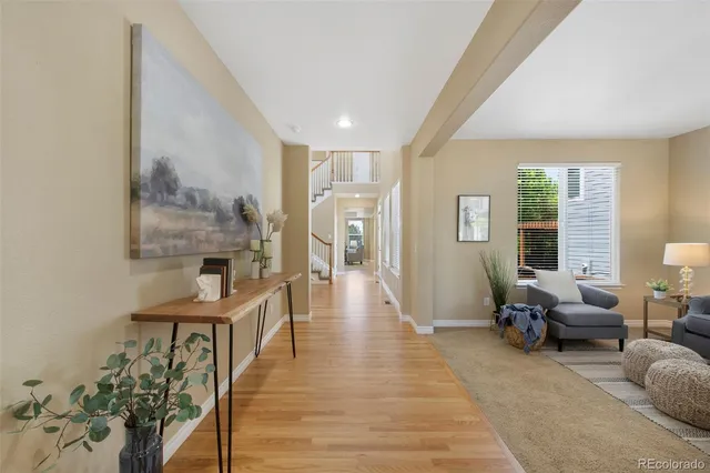 a view of a livingroom with furniture and hardwood floor