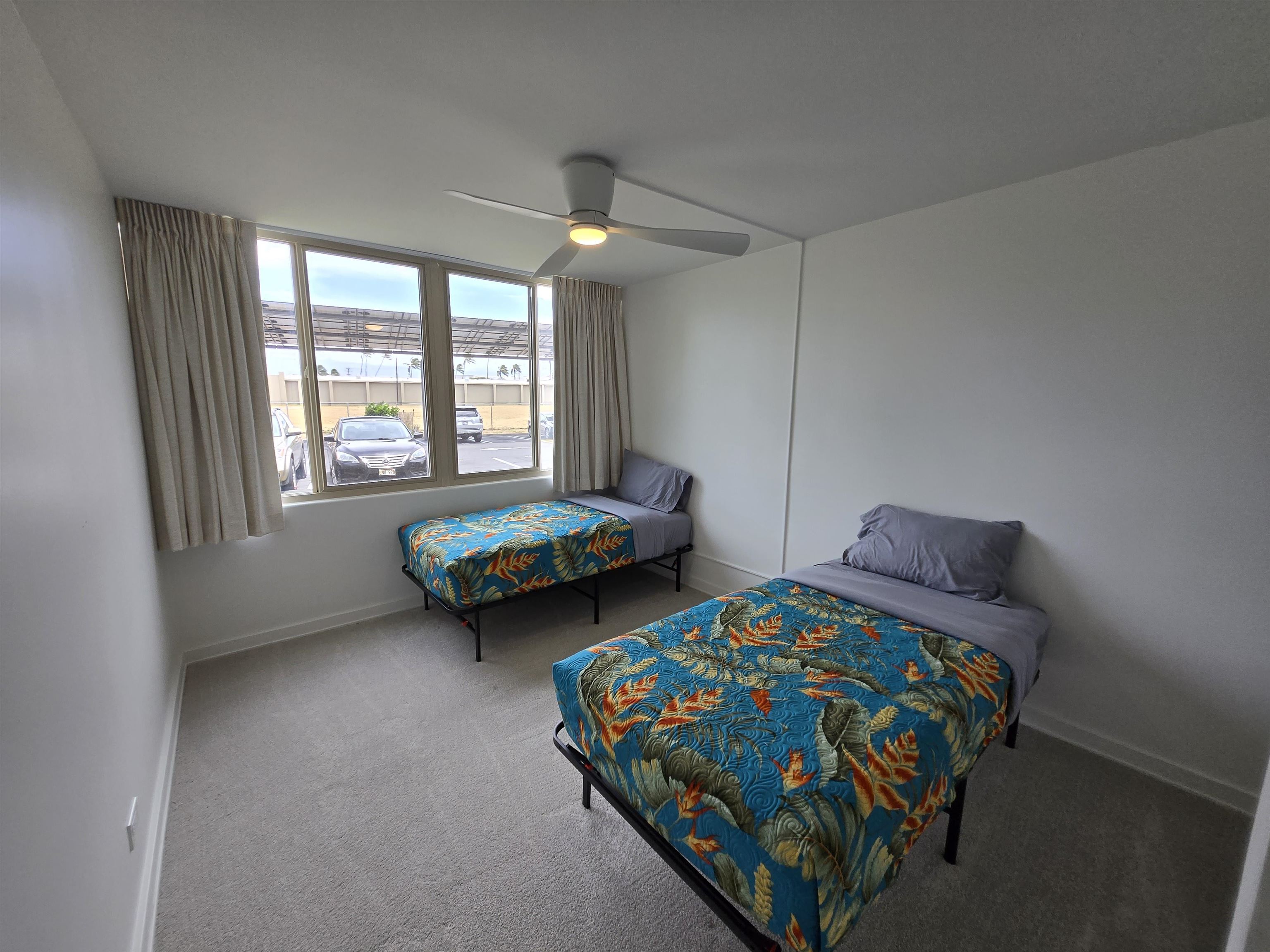 111 Kahului Beach Road, Unit B114 Kahului, HI 96732 - Photo 5 of 11 a bedroom with two beds and a window