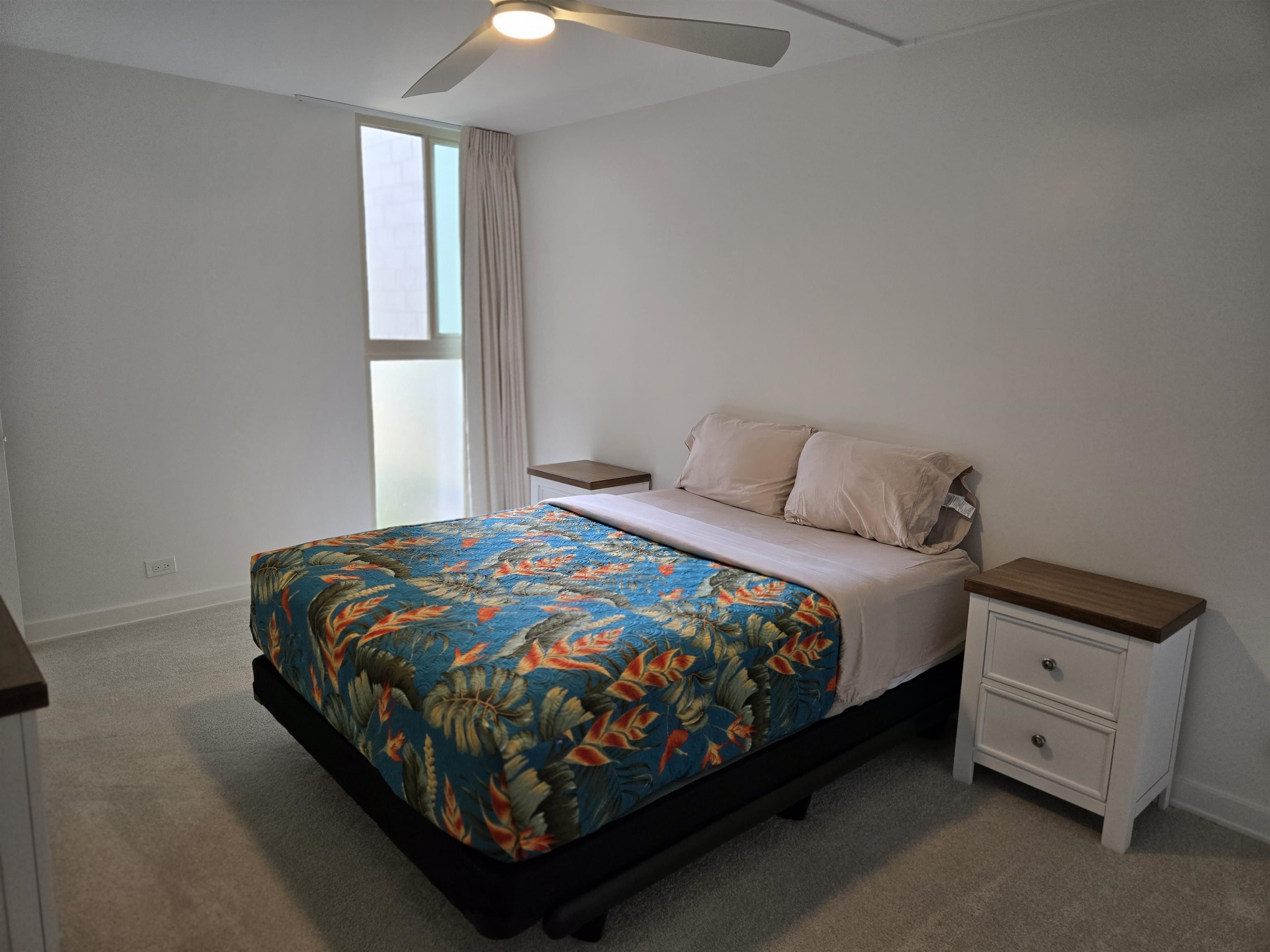 111 Kahului Beach Road, Unit B114 Kahului, HI 96732 - Photo 8 of 11 a bedroom with a bed and a window