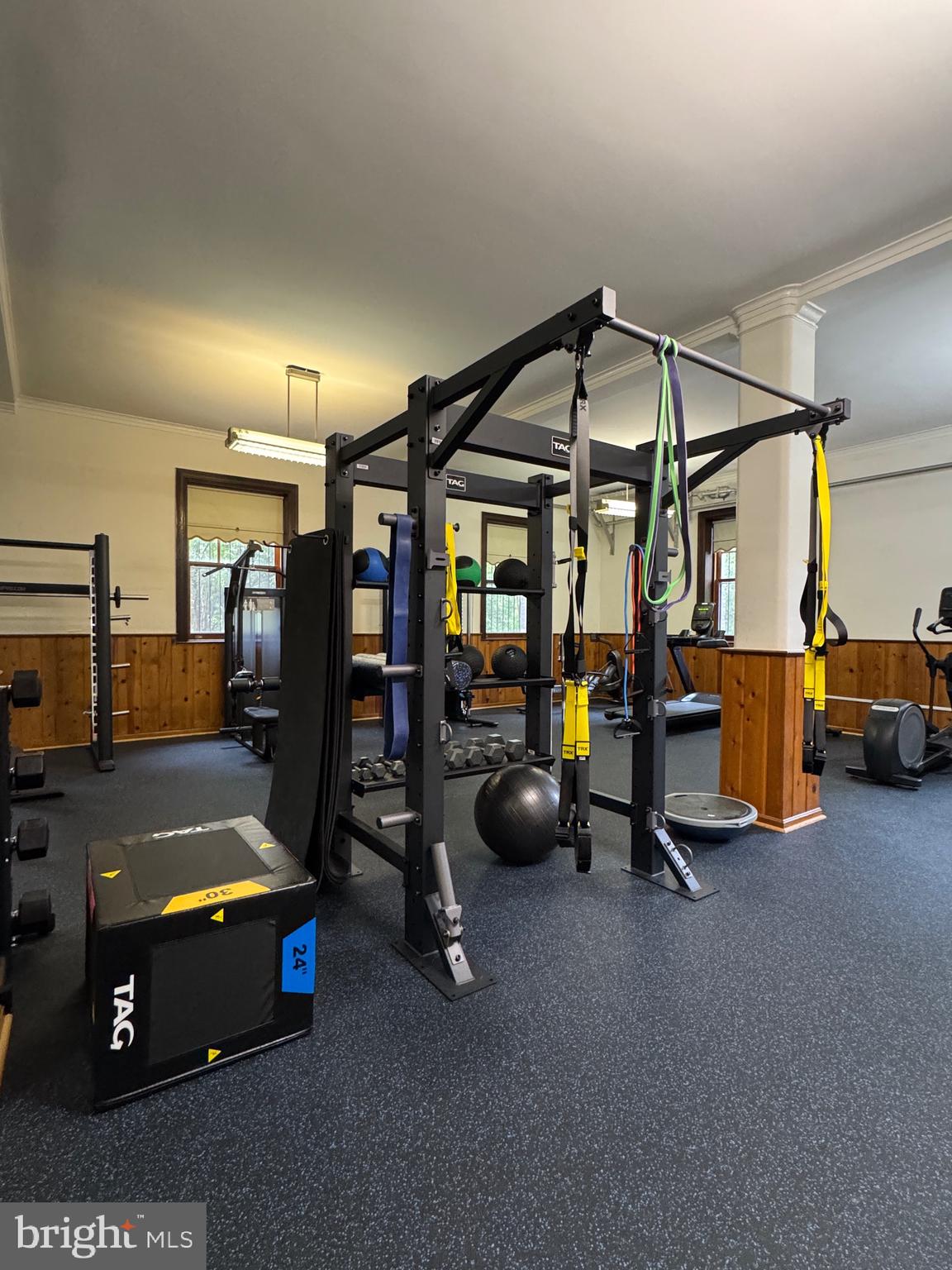 2853 Ontario Road Northwest, Unit 210 Washington, DC 20009 - Photo 24 of 28 a room with gym equipment and wooden floors