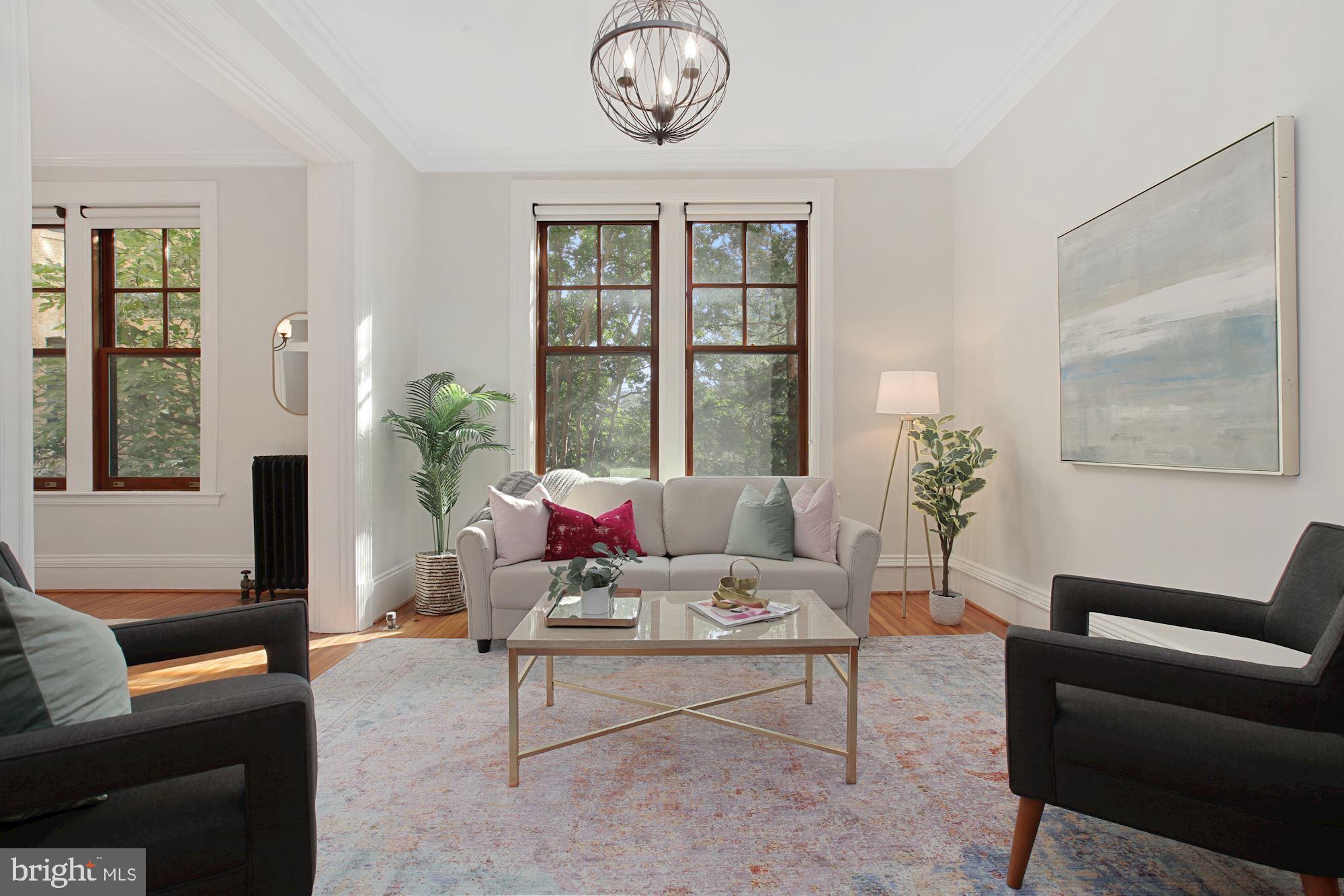 2853 Ontario Road Northwest, Unit 210 Washington, DC 20009 - Photo 4 of 28 a living room with furniture and a large window