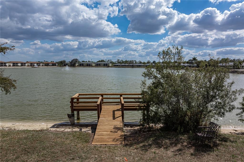 25225 Rampart Boulevard, Unit 1606 Punta Gorda, FL 33983 - Photo 11 of 34 a view of a lake with houses in the back