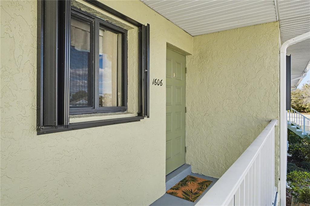 25225 Rampart Boulevard, Unit 1606 Punta Gorda, FL 33983 - Photo 15 of 34 a view of a balcony and wooden floor