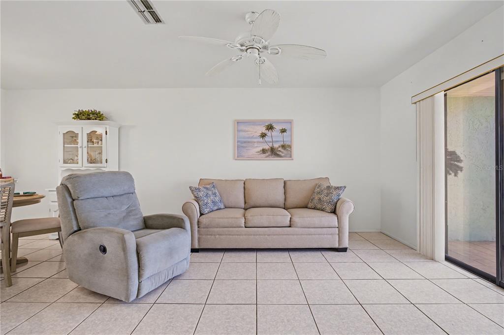 25225 Rampart Boulevard, Unit 1606 Punta Gorda, FL 33983 - Photo 22 of 34 a living room with furniture and a window