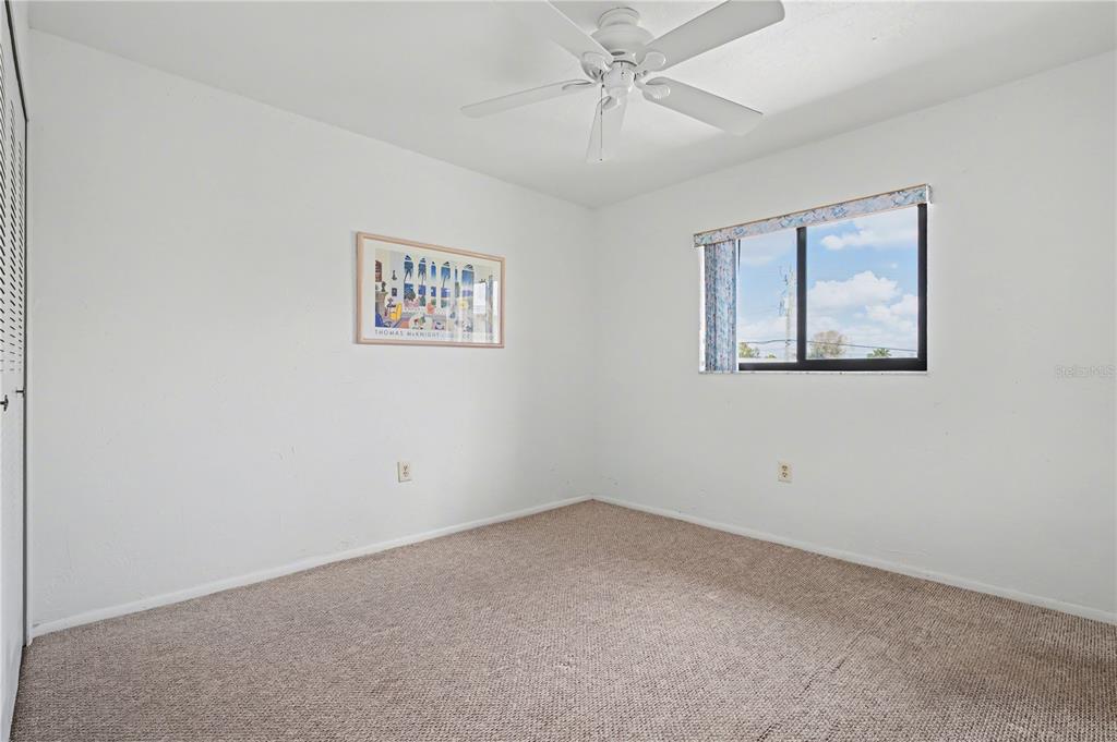 25225 Rampart Boulevard, Unit 1606 Punta Gorda, FL 33983 - Photo 28 of 34 an empty room with a window