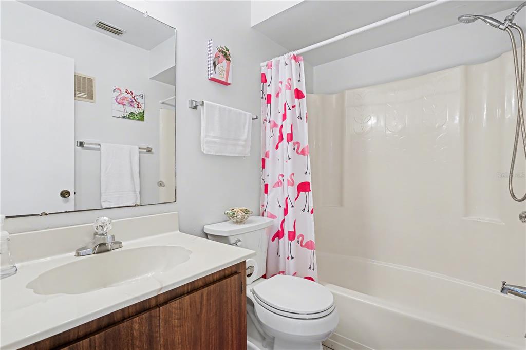 25225 Rampart Boulevard, Unit 1606 Punta Gorda, FL 33983 - Photo 30 of 34 a bathroom with a sink toilet and shower