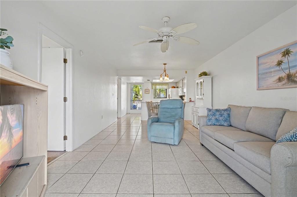 25225 Rampart Boulevard, Unit 1606 Punta Gorda, FL 33983 - Photo 3 of 34 a living room with furniture and a dining table