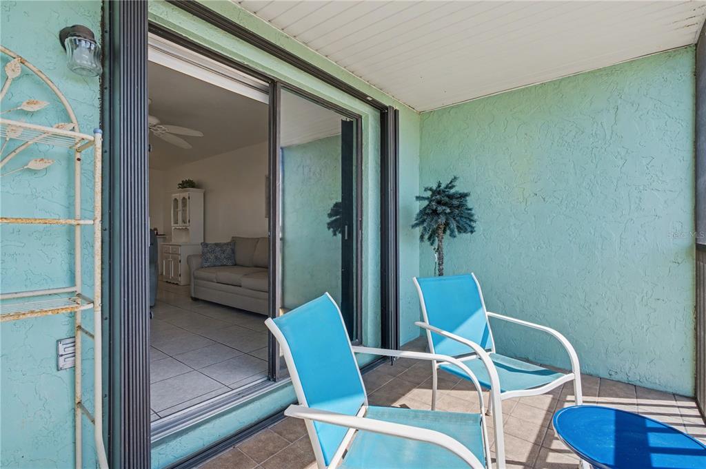25225 Rampart Boulevard, Unit 1606 Punta Gorda, FL 33983 - Photo 32 of 34 a living room with furniture and a potted plant