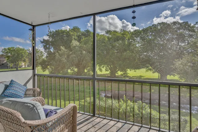 a view of a balcony with furniture
