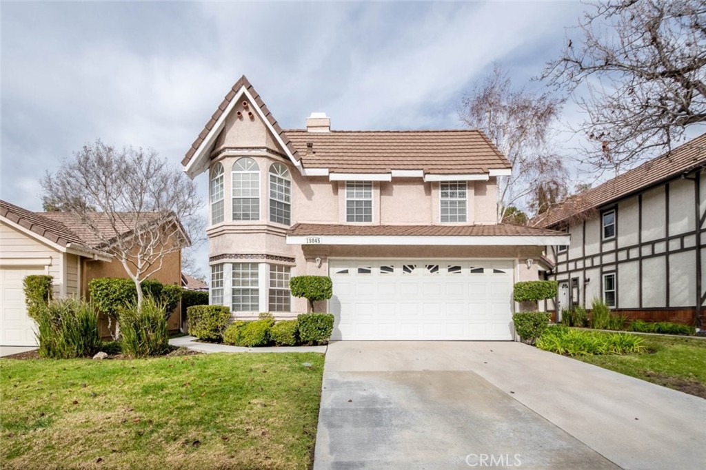 19845 Collins Road Canyon Country, CA 91351 - Photo 1 of 1 a front view of a house with a yard