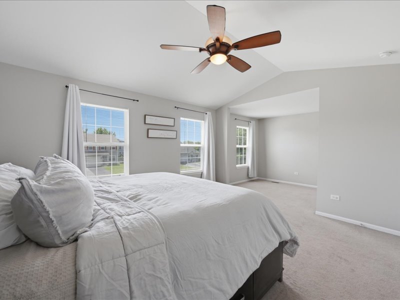 4201 Dillon Street Plano, IL 60545 - Photo 24 of 37 a bedroom with a bed and a large window