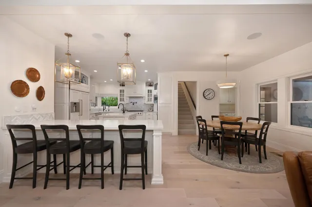 a spacious bathroom with a sink a mirror and a shower