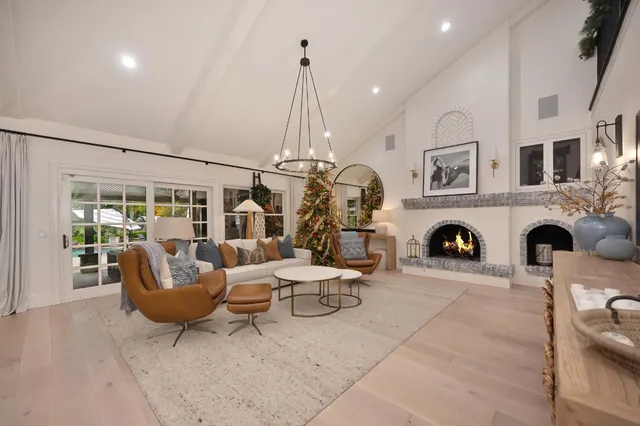 a spacious bedroom with a bed and a view of kitchen