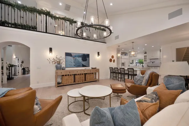 a bathroom with a sink a potted plant and a mirror