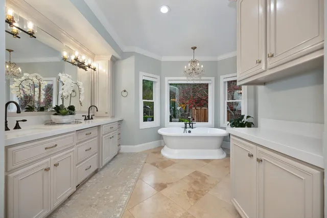 an aerial view of a house with swimming pool patio and outdoor seating