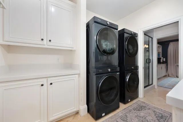 a view of a chair and table in backyard of the house