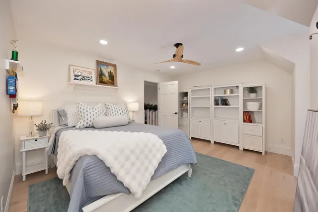 a front view of a house with a garden and pathway