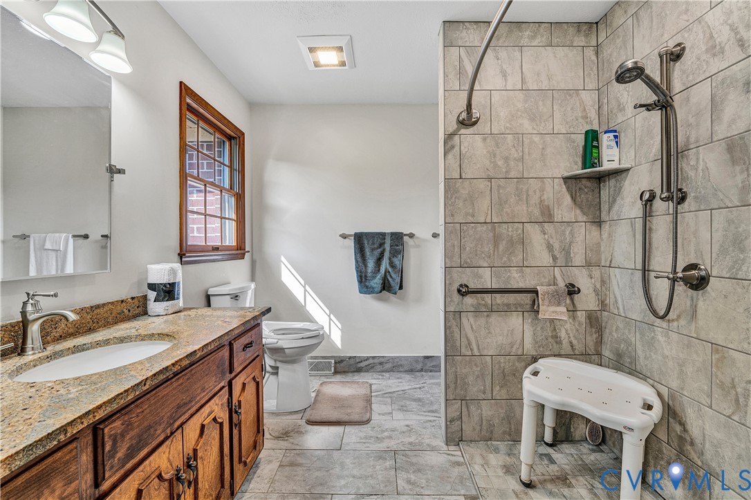 258 Willow Oak Road Appomattox, VA 24522 - Photo 19 of 50 Spacious bathroom featuring a wood-finish vanity w